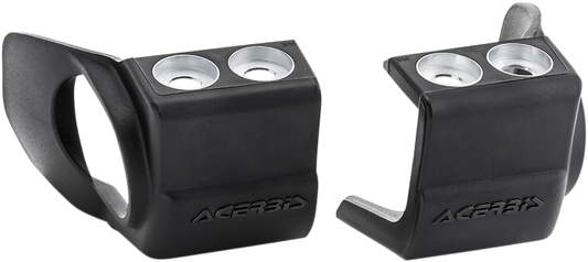 Acerbis black shoe protectors for inverted forks, designed to shield motorcycle suspension components.