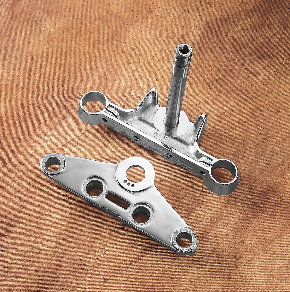 Chrome Drag Specialties FL-Style Triple Tree for Harley Big Twin motorcycles, featuring detailed metal finish and mounting points.