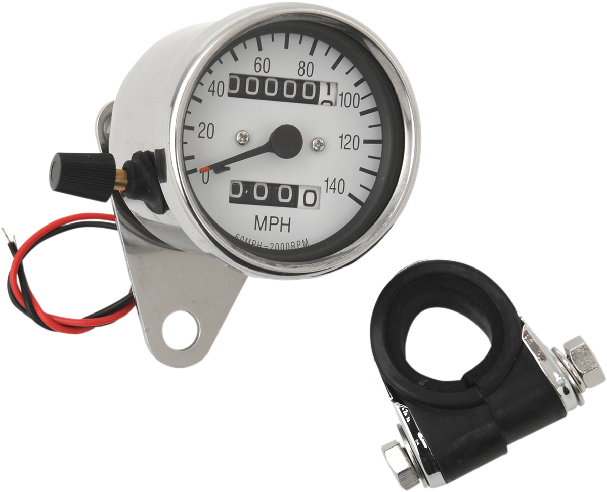 Drag Specialties 2.4-inch MPH Mini LED mechanical speedometer with white face, chrome housing, indicators, and trip function.