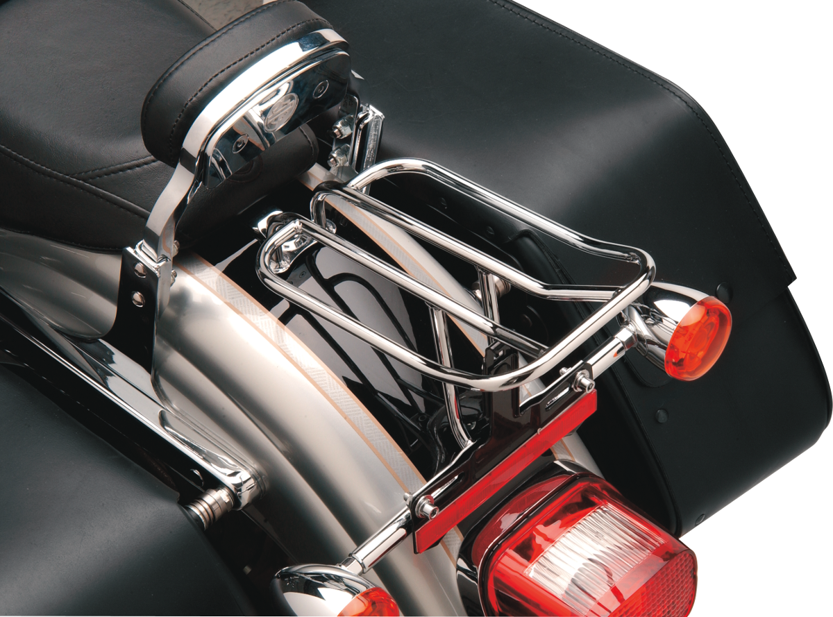 Chrome luggage rack for FXD motorcycles, designed by Drag Specialties, with a sturdy metal frame and chrome finish.