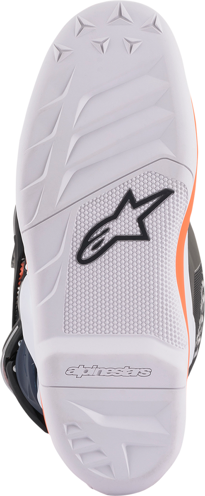 Alpinestars Youth Tech 7S motorcycle boots in black, orange, and white with buckle closures and reinforced toe area.