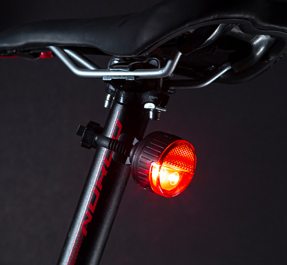 Bill's Exhausts SP CONNECT All-Round LED Safety Light in red, 100 lumens, attached to a phone for visibility and safety.