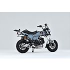 Over Racing spiral full titanium exhaust for Honda Monkey 125 and DAX 125, featuring a sleek, lightweight design and polished finish.