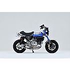Over Racing spiral full titanium exhaust for Honda Monkey 125 and DAX 125, showcasing the sleek, lightweight exhaust pipe.