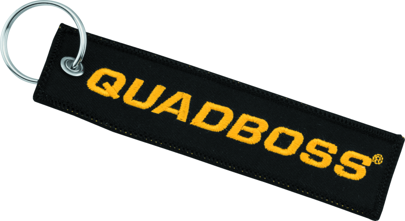 QuadBoss Ripcord keychain with embroidered logo, durable powersports accessory featuring black nylon strap and metal clip.