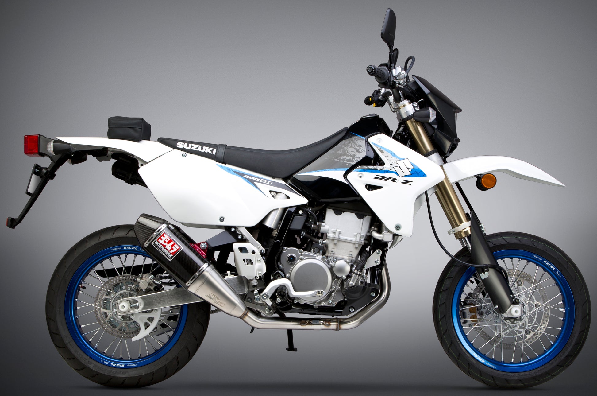 YOSHIMURA Signature RS 4 full exhaust system for dual applications, showcasing the sleek stainless steel muffler and dual pipes.