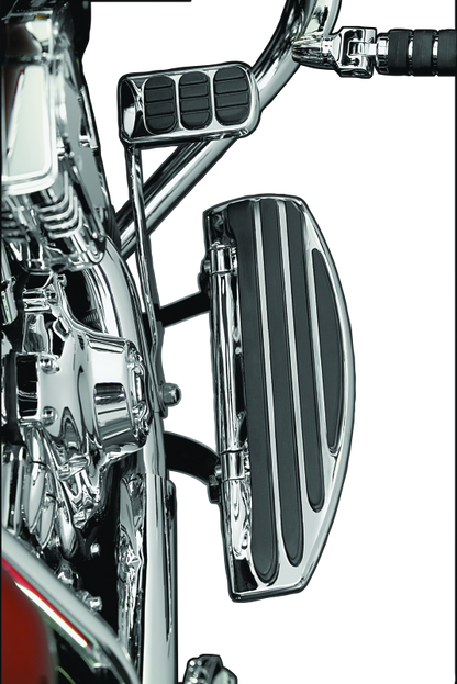 Kuryakyn Running Board Extensions for Harley-Davidson Touring models, showing chrome finish and extended foot support.