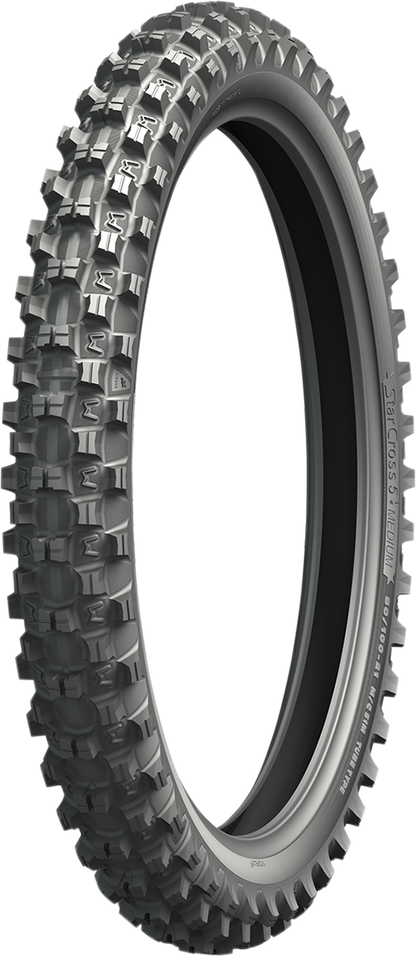 Michelin StarCross 5 Medium front tire with 70/100-19 size and 42M load rating, shown on a motorcycle wheel.