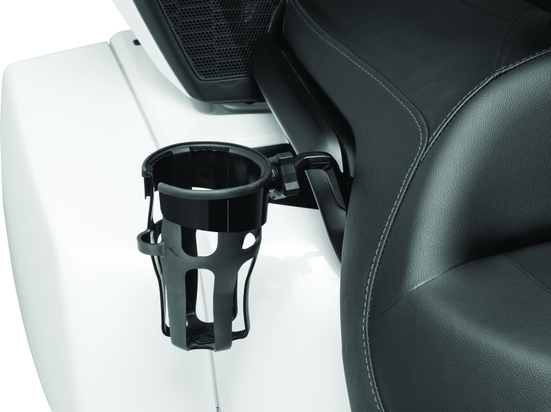 Kuryakyn Reflex drink holder for Harley Touring models, mounted on motorcycle handlebar, with black finish and secure grip design.