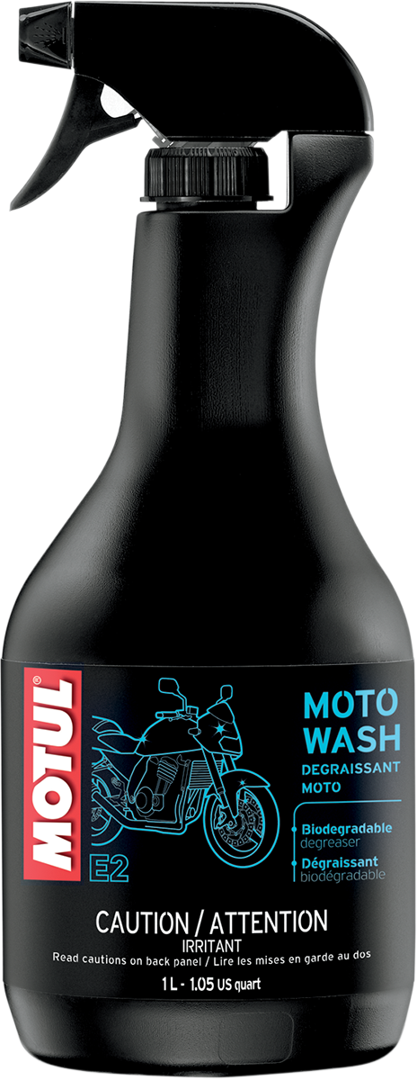 MOTUL Moto Wash 1L biodegradable motorcycle cleaner with protective film, showing a spray bottle and motorcycle being cleaned.
