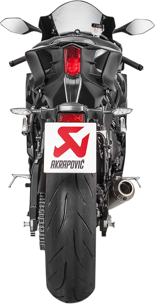 AKRAPOVIC slip-on titanium muffler for Yamaha YZF-R6 motorcycle, showcasing the sleek, metallic exhaust design.