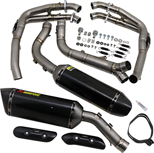 AKRAPOVIC Evolution carbon fiber exhaust for Yamaha YZF-R1 motorcycle, with sleek carbon fiber finish and polished metal components.