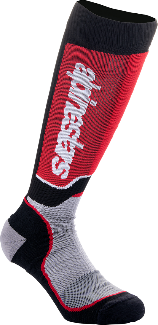 Alpinestars Youth MX Plus motocross socks in black, red, and gray, featuring reinforced areas and breathable fabric, in medium/large size.
