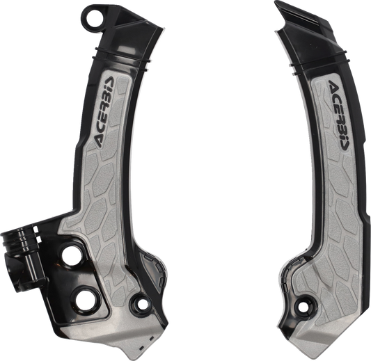 Acerbis X-Grip frame guards in black and gray mounted on a motorcycle frame, providing protection for the bike's body.