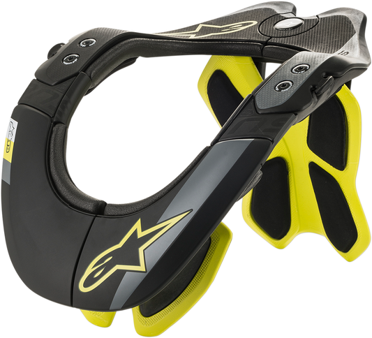 Alpinestars BNS Tech 2 Youth Impact Protection Helmet in black and yellow fluo, XS-M size, with adjustable straps and impact protection features.