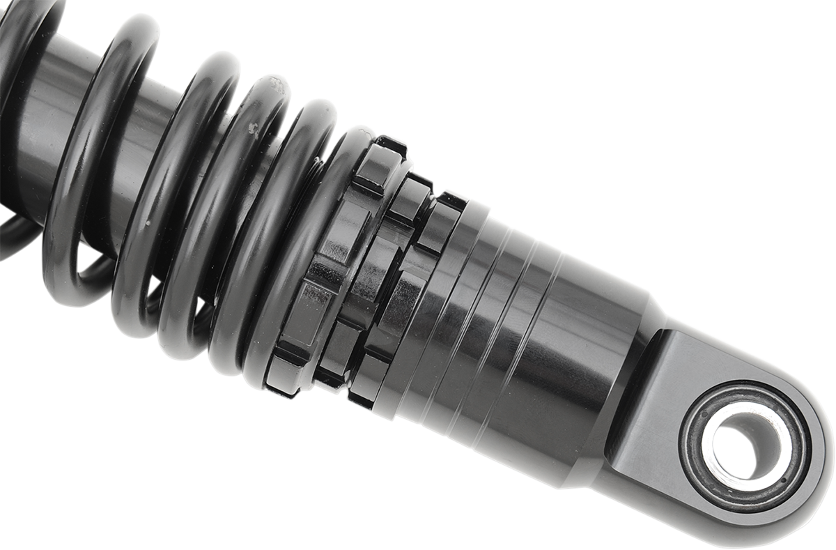 Black 12-inch DRAG SPECIALTIES SHOCKS premium ride-height adjustable shocks on a motorcycle.