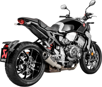 AKRAPOVIC titanium muffler for Honda CB1000R motorcycle, showing sleek exhaust design and branding on the part.