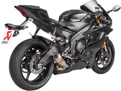 AKRAPOVIC slip-on titanium muffler for Yamaha YZF-R6 motorcycle, featuring sleek design and polished finish.