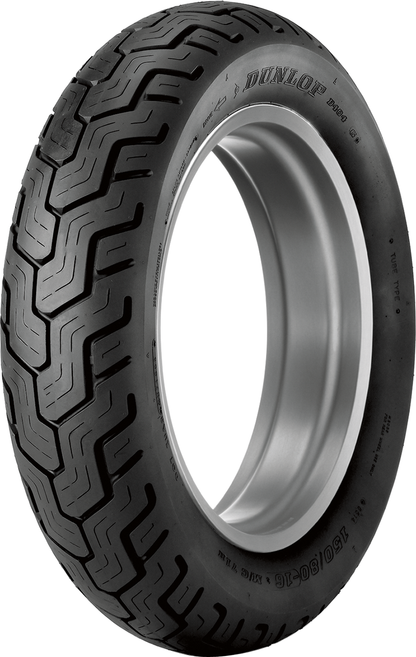 Dunlop D404 front motorcycle tire with 150/80-16 whitewall and 71H load rating on a motorcycle wheel.