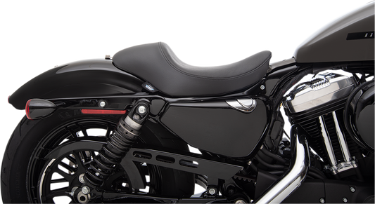 Black smooth 3/4 solo seat for Harley-Davidson XL by Drag Specialties, offers improved comfort and stylish design.