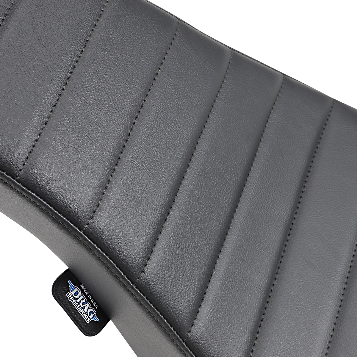 Drag Specialties Spoon Seat for FX/FL motorcycles, vintage-style classic seat with black leather and chrome accents.