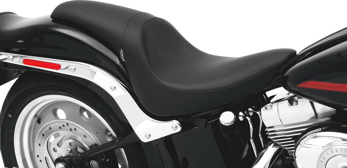 Black smooth Predator Seat for Harley FL/FX by Drag Specialties, compatible with 2006-2017 models.