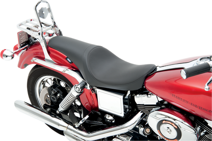 Drag Specialties Predator Seat for FXD 1996-2003, smooth black motorcycle seat shown on a Harley Davidson motorcycle.