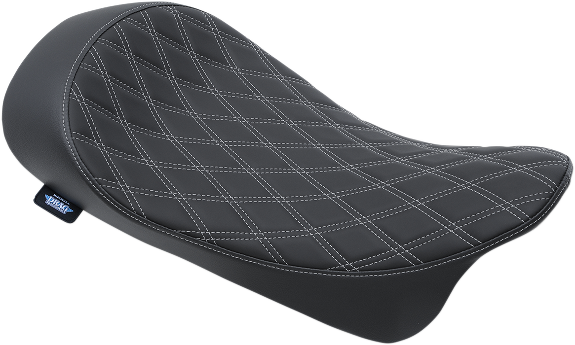 Drag Specialties low solo seat with double diamond silver stitching for Harley FL 2008-2023 motorcycle, shown from the side.