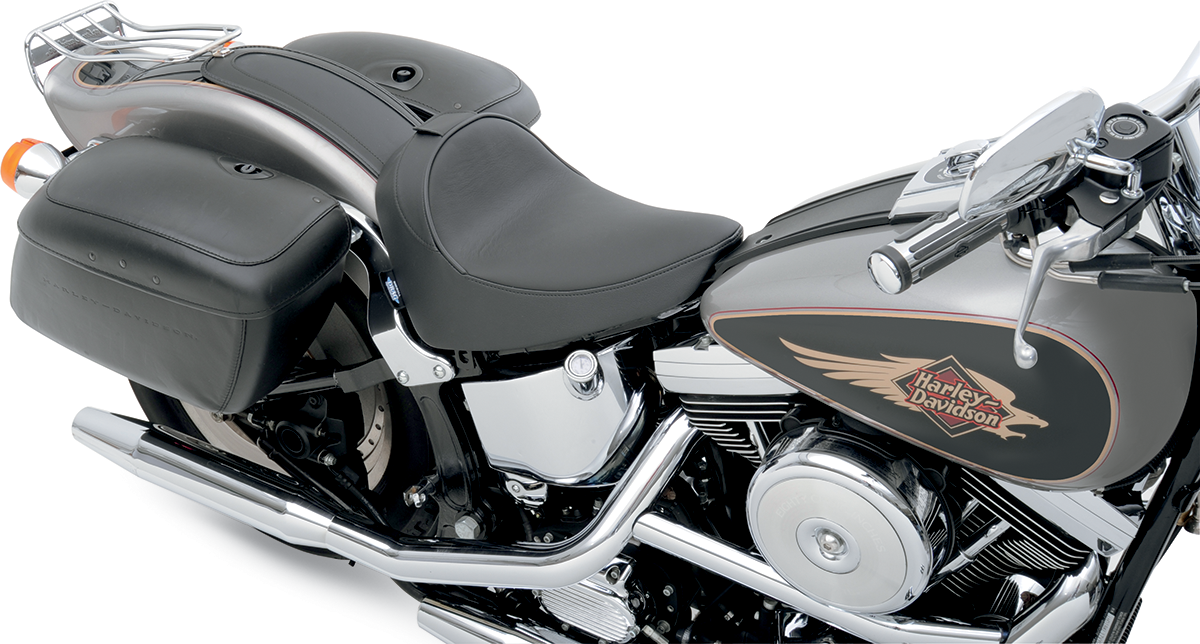 Drag Specialties solo motorcycle seat with driver backrest for FXST/FLST 1984-1999, smooth finish and cooler surface.