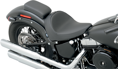 Drag Specialties solo motorcycle seat with backrest for FXS/FLS 2011-2017, smooth design and comfortable padding.