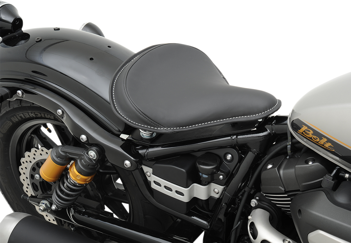Black leather solo seat by Drag Specialties with white stitching and solar-reflective material for Harley-Davidson motorcycles.