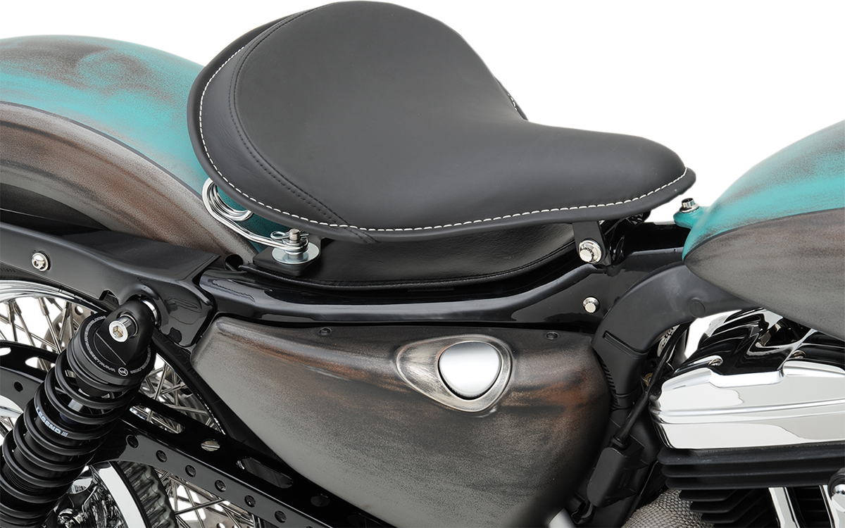 Large black solar-reflective leather solo seat by Drag Specialties with white perimeter stitching for motorcycle comfort and style.