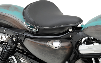 Large black solar-reflective leather solo seat by Drag Specialties with white perimeter stitching for motorcycle comfort and style.