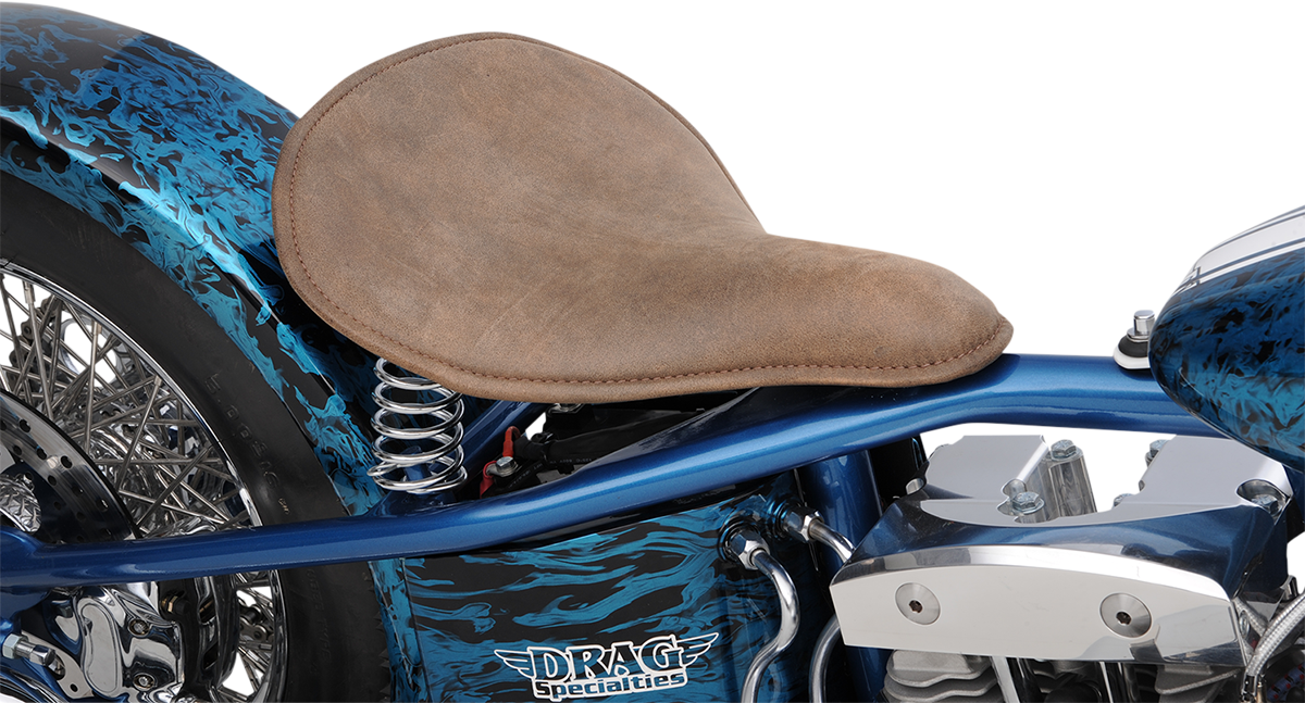 Drag Specialties solo spring seat in low-profile brown with perimeter stitch, designed for bobber style motorcycles.