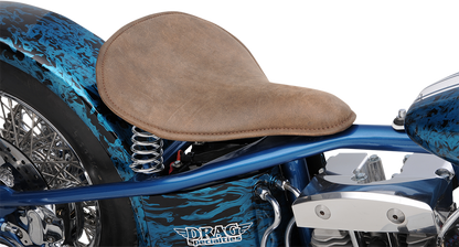 Drag Specialties solo spring seat in low-profile brown with perimeter stitch, designed for bobber style motorcycles.