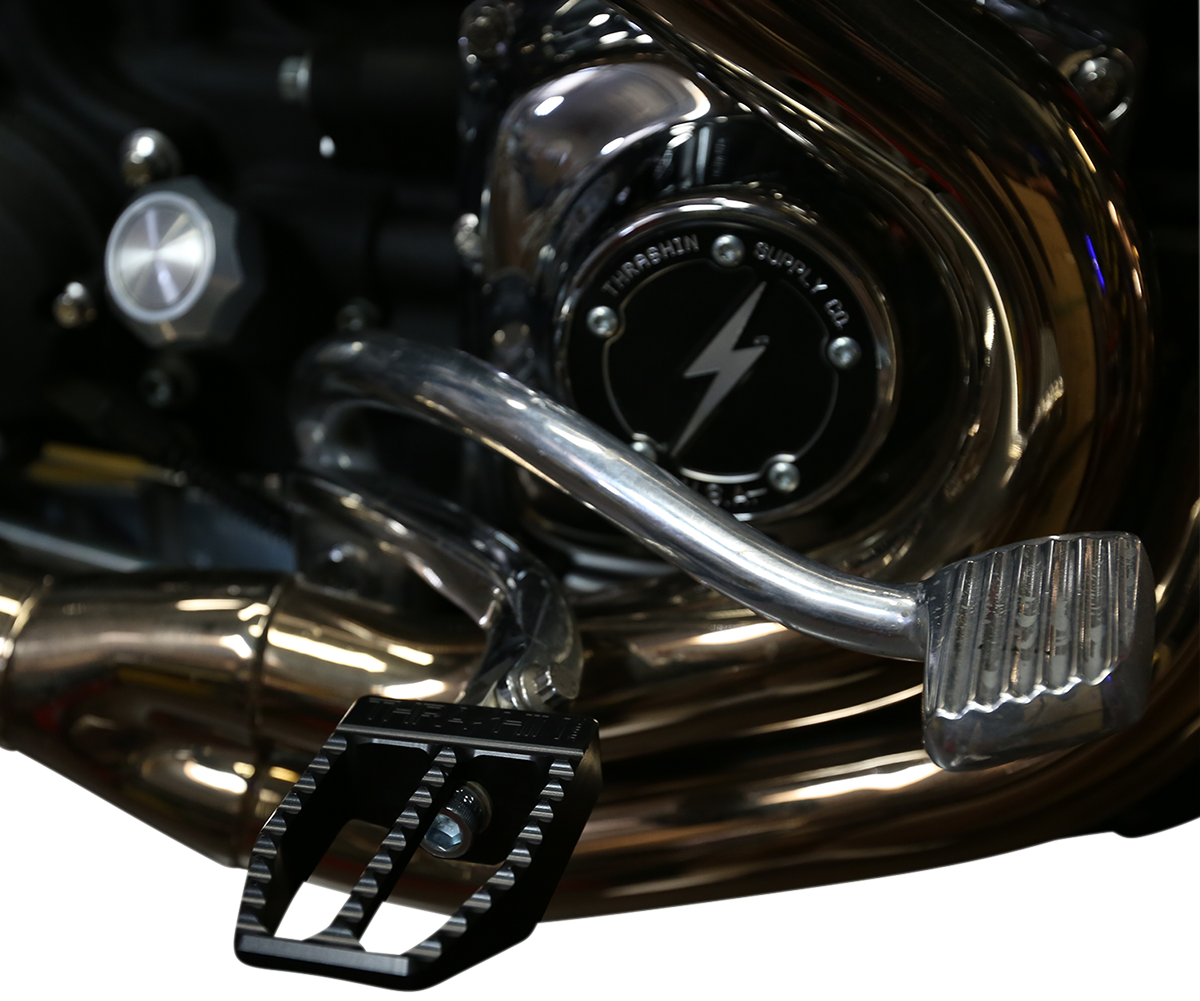 Black Thrasin Supply Co. Militant foot pegs for Dyna motorcycle, designed for durability and style.