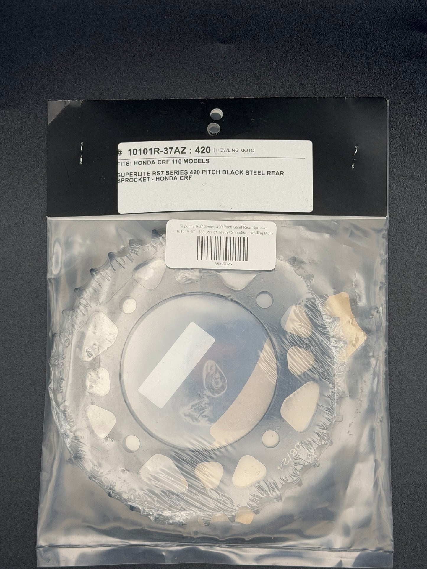 Superlite RS7 Series 420 pitch steel rear sprocket for Honda CRF110 motorcycle, showing the sprocket's teeth and metal finish.