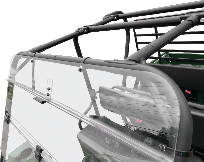 QuadBoss folding windshield for Kawasaki KAF620 Mule 4010 4x4, showing the clear, foldable safety windshield in a natural outdoor setting.