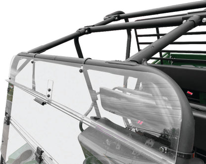 QuadBoss folding windshield for Kawasaki KAF620 Mule 4010 4x4, showing the clear, foldable safety windshield in a natural outdoor setting.