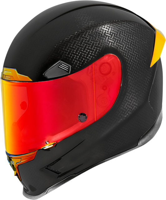Red ICON Airframe Pro™ helmet in carbon fiber with XS size, featuring sleek design and aerodynamic shape for motorcycle riding.