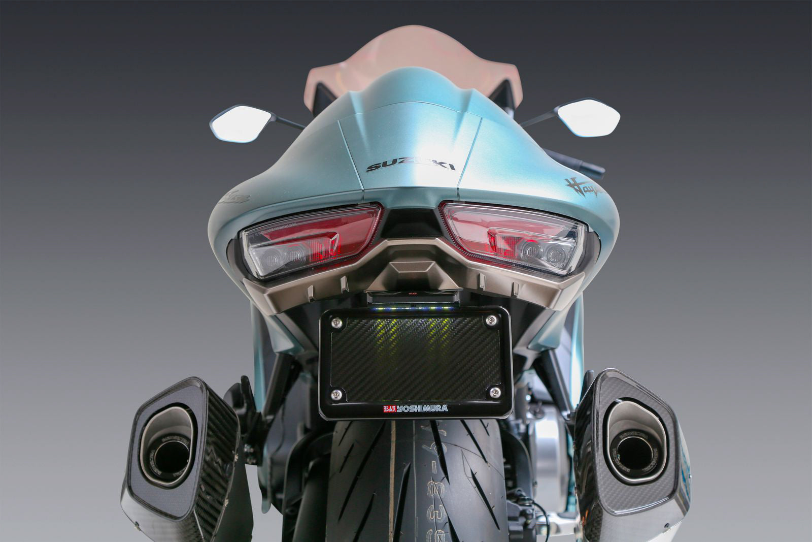 YOSHIMURA V2 Fender Eliminator Kit for Suzuki motorcycle, featuring sleek design and mounting hardware, part number 075BG112110.