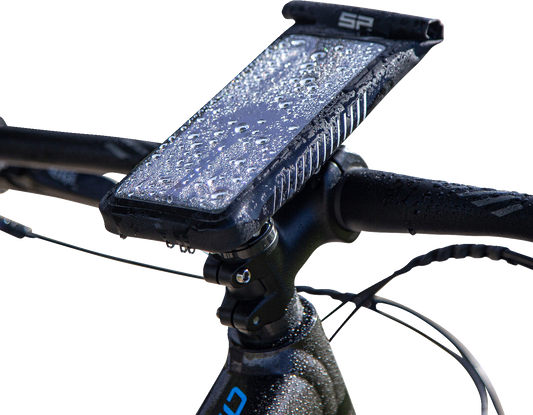 Universal SP CONNECT phone holder kit by Bill's Exhausts, showing the adjustable mount and phone cradle attached to a bike handlebar.