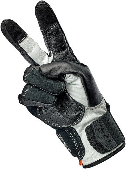 Black and cement BILTWELL Borrego gloves in medium size, featuring textured leather and secure wrist closure for motorcycle riding.