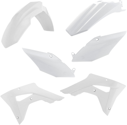 White ACERBIS standard replacement body kit for motorcycles, shown on a workbench with tools and parts.