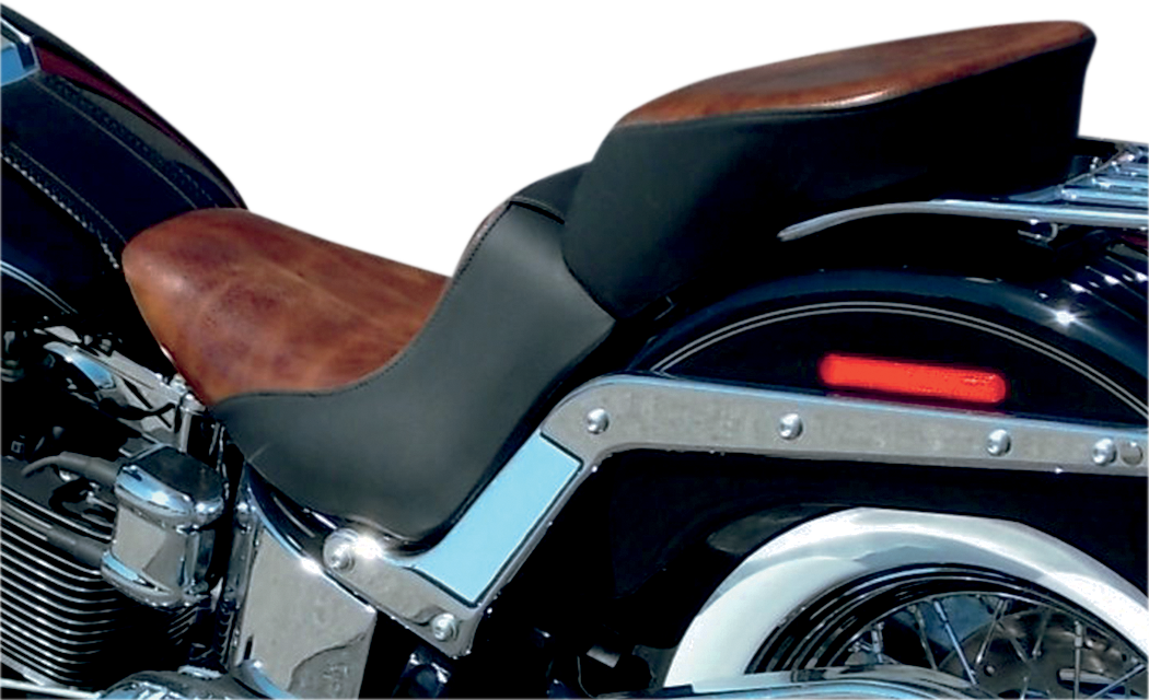 Bill's Exhausts SADDLEMEN Lariat Seat for FLSTN/C motorcycle, featuring a sleek, padded design with detailed stitching.