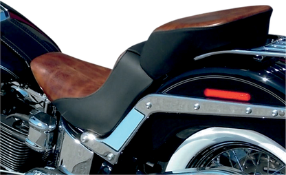 Bill's Exhausts SADDLEMEN Lariat Seat for FLSTN/C motorcycle, featuring a sleek, padded design with detailed stitching.