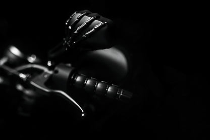 Kuryakyn Skeleton Hand Mirrors in black for powersports vehicles, showing detailed skeletal design on motorcycle mirror.