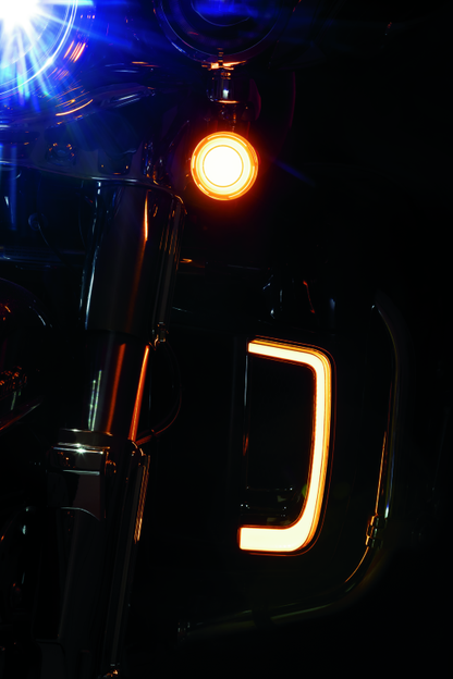 Kuryakyn Tracer Lower Fairing Grill in chrome for Harley Davidson Touring models, showcasing sleek, shiny motorcycle front fairing detail.