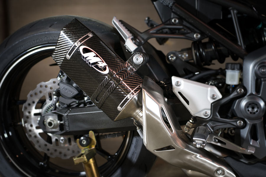 Carbon fiber slip-on exhaust for Kawasaki Z900 2017-2025, stylish design, from Bill's Exhausts, with detailed close-up view.