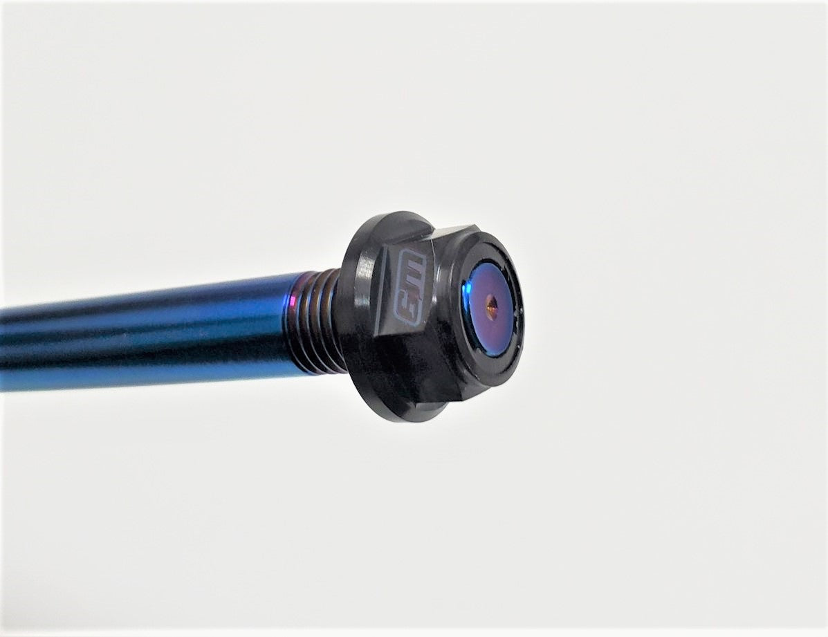 Surron Titanium Swingarm Bolt with Nut by Warp9Racing, shown on a Surron electric motorcycle, highlighting durable titanium construction.